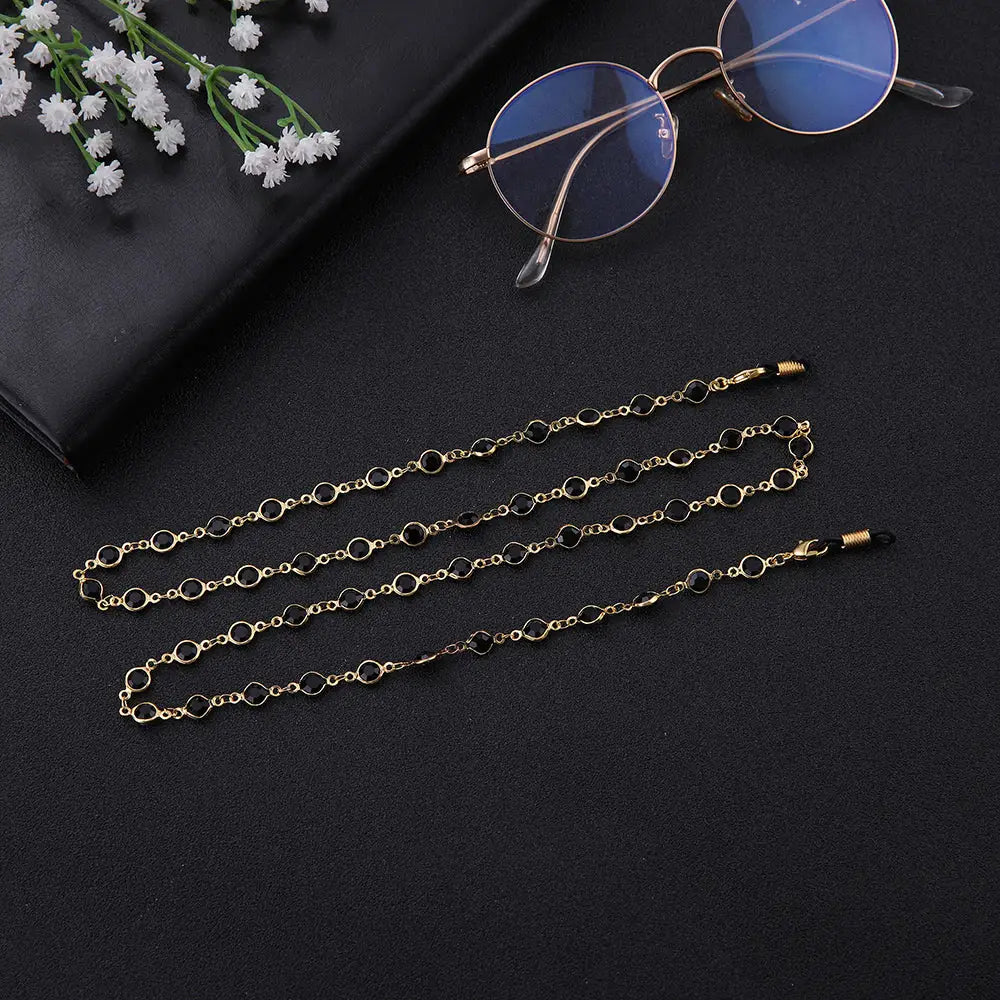 Goldene Kettenbrillenhalter mit schwarzen Perlen für Brille und Halskette