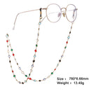 Runde Brillengestelle mit buntem, goldenem Juwelen-Perlenhalsband