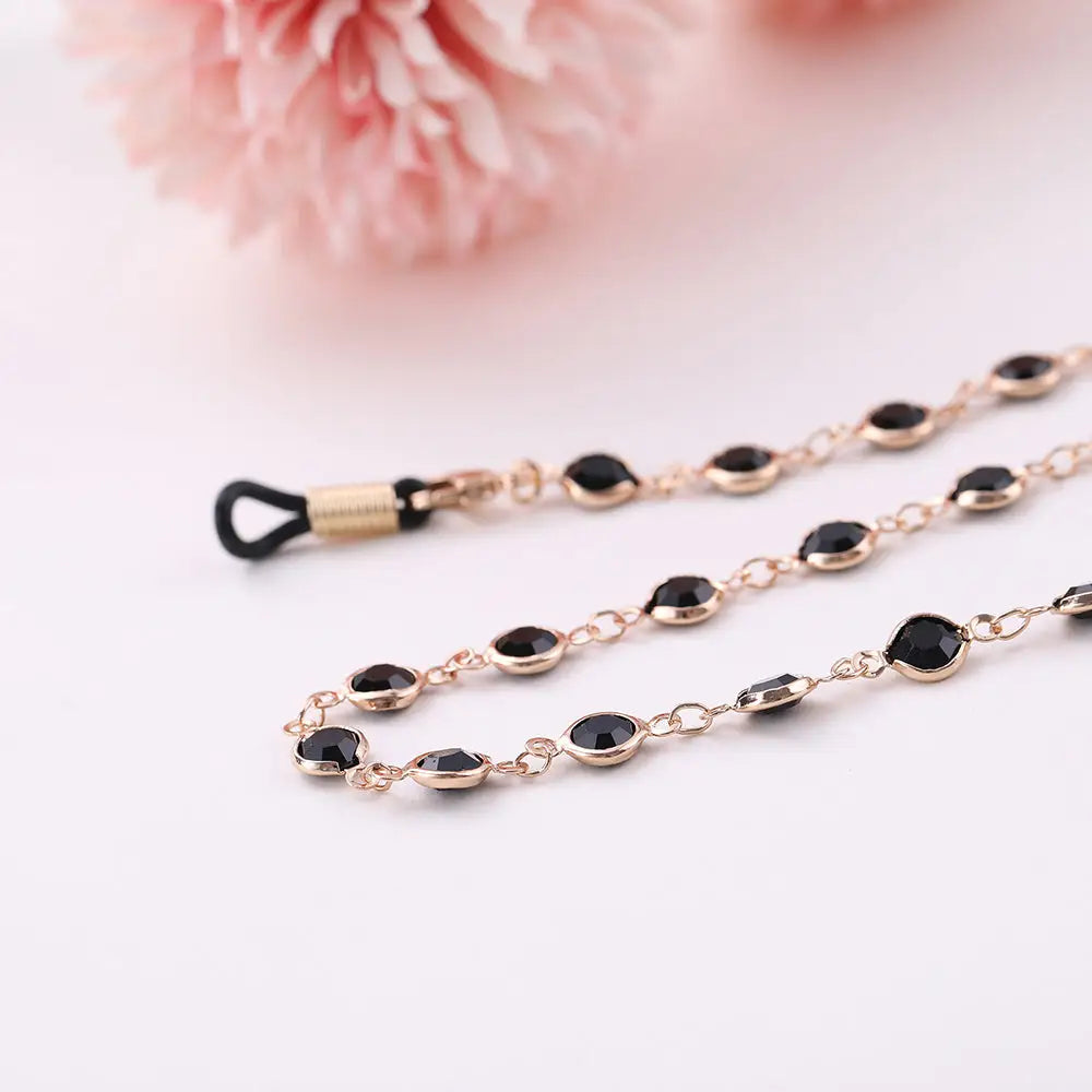 Goldene Kettenbrillehalter mit schwarzen Edelsteinen für Brillenkette Schwarz Rose