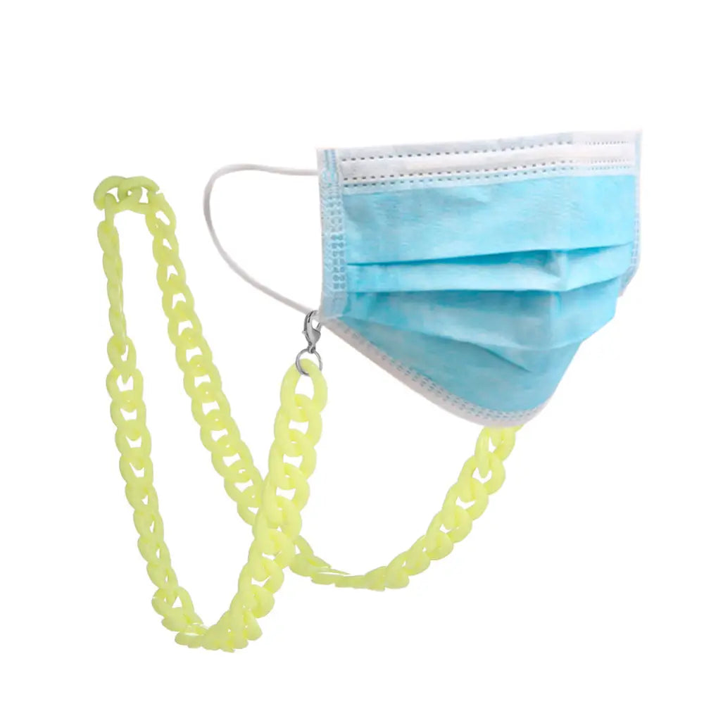 Hellgelbe Brillenkette mit blauer chirurgischer Maske als Halter für Brillen