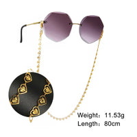 Rimlose Sonnenbrille mit goldener Herz-Kette Halskette für Brillen Herz Rose