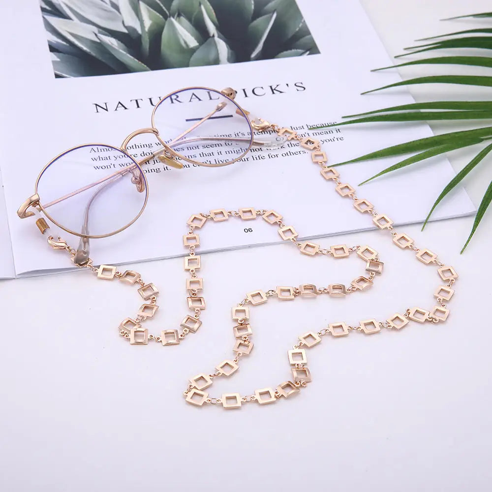 Goldrandbrille mit Quadrat-Linked-Kette Halter für Brillen in Rosefarben