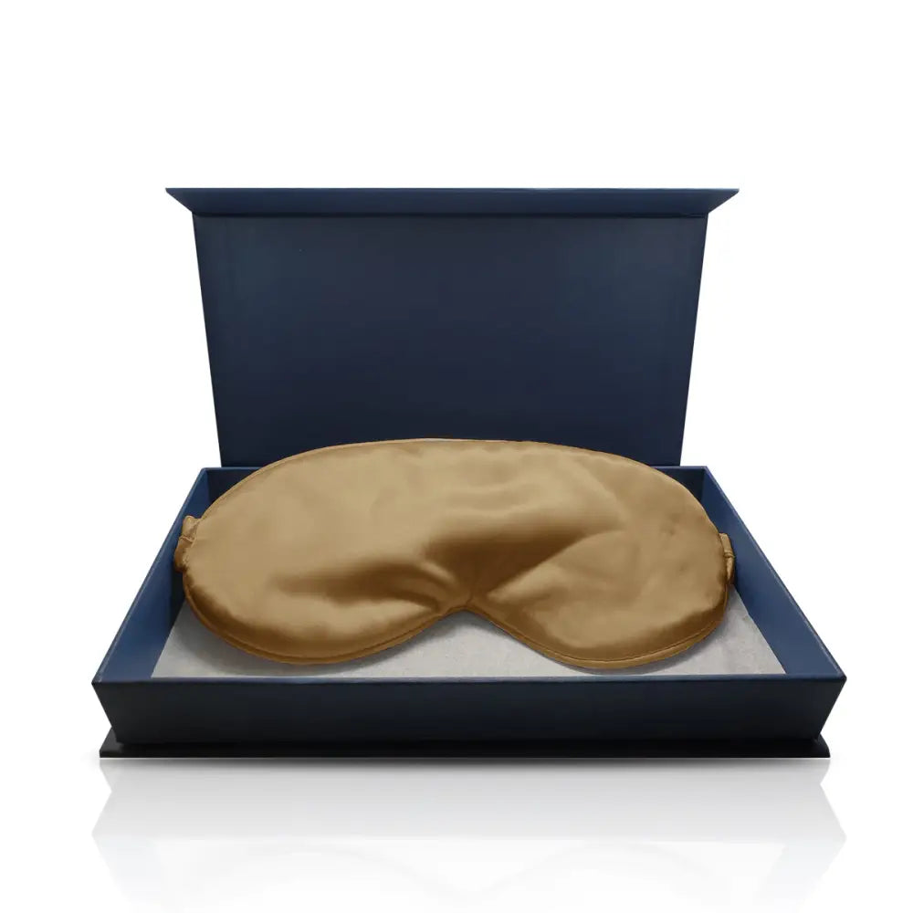 Goldene Schlaf-Seidenmaske in blauer Verpackung, luxuriöses Schlafaccessoire
