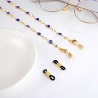 Goldene Brillenkette mit blauen Edelsteinen für stilvollen Halter und Accessoire