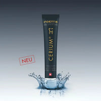 Schwarze Zahnpasta Tube mit Wasserspritz und INDENTIS CERIUM® ZAHNPASTA